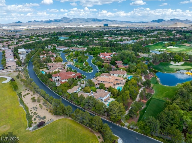 aerial view featuring a water and mountain view