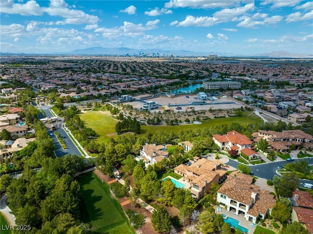 birds eye view of property with a mountain view