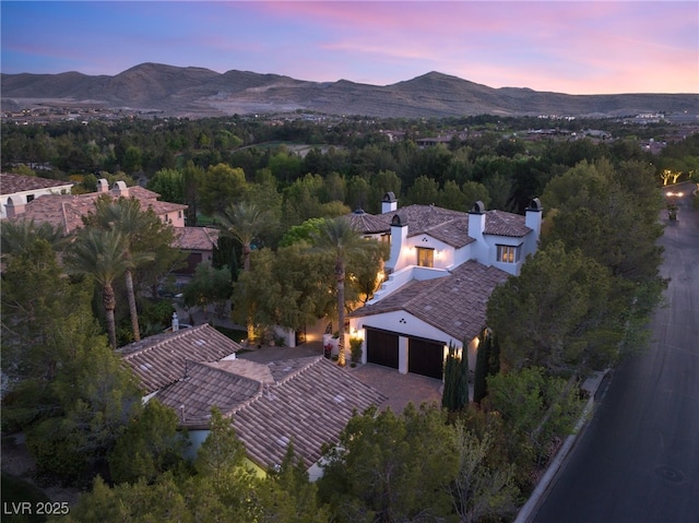 aerial view at dusk with a mountain view