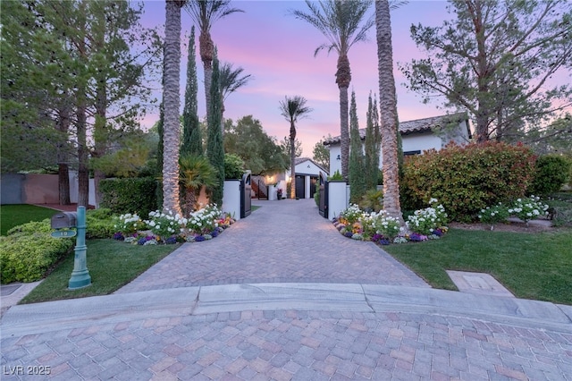 view of property's community with a lawn