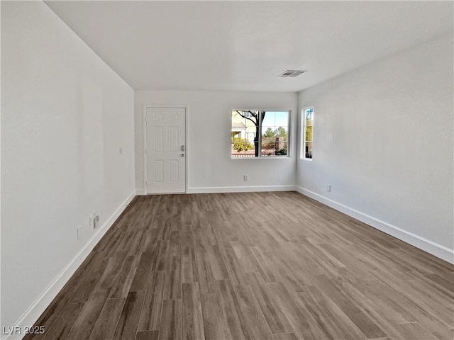 unfurnished room featuring hardwood / wood-style floors