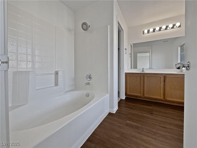 bathroom with vanity, tub / shower combination, and hardwood / wood-style floors