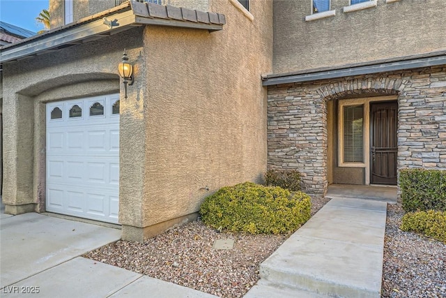 view of exterior entry with a garage