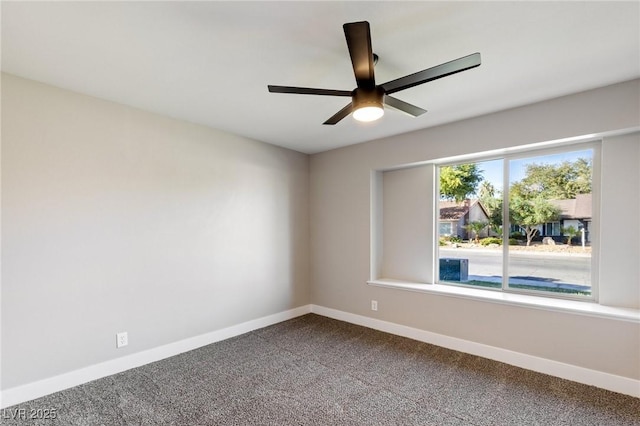 empty room featuring ceiling fan and carpet flooring