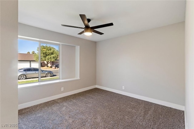 empty room with ceiling fan and carpet