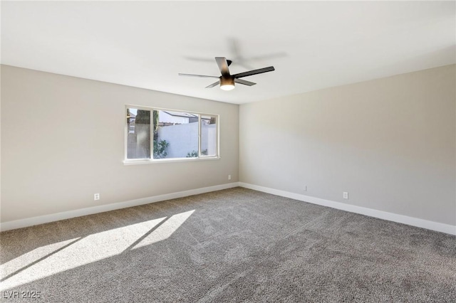 unfurnished room with ceiling fan and carpet floors