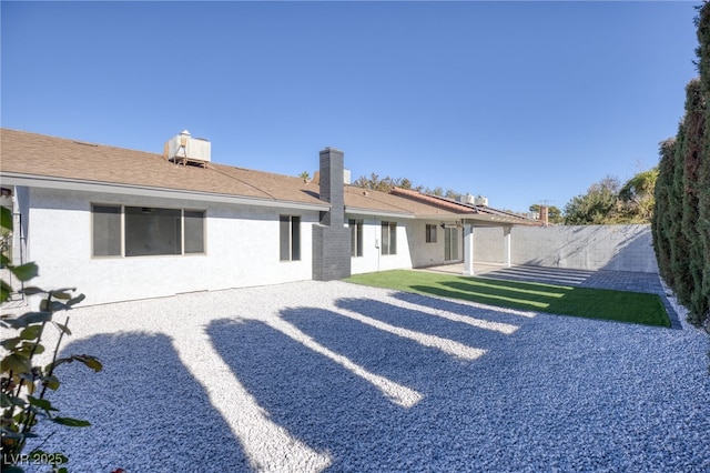 rear view of property featuring a patio