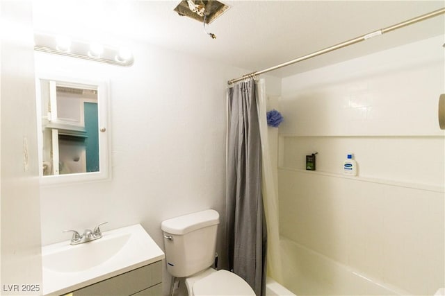 full bathroom featuring vanity, shower / tub combo with curtain, and toilet