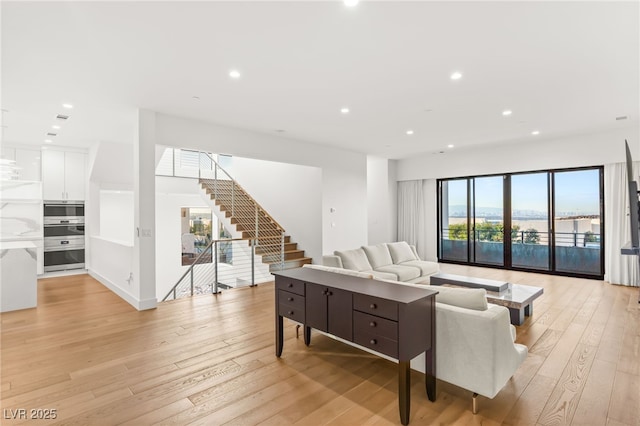 living room with light hardwood / wood-style flooring