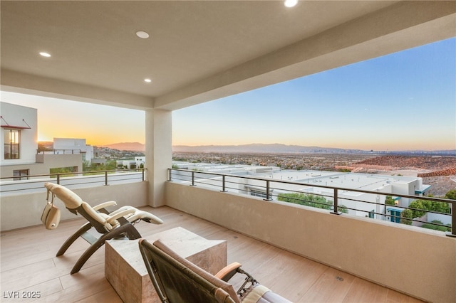 balcony at dusk with a mountain view