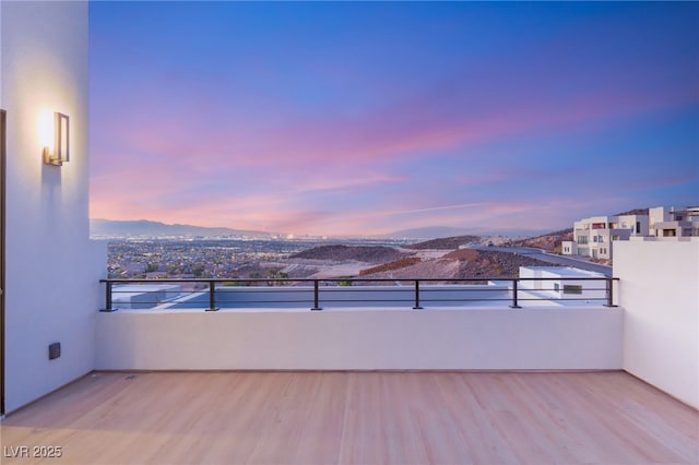 view of balcony at dusk