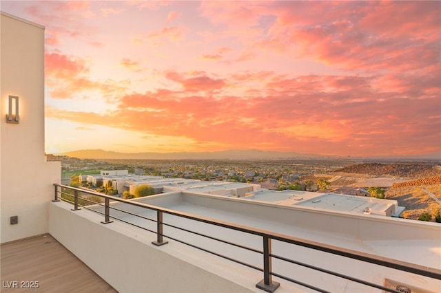 view of balcony at dusk