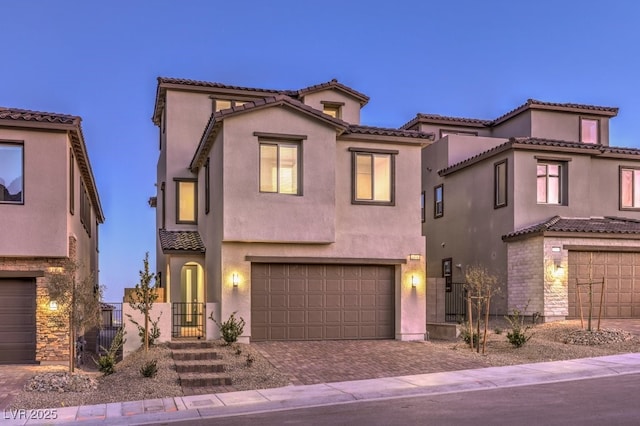 mediterranean / spanish house featuring a garage