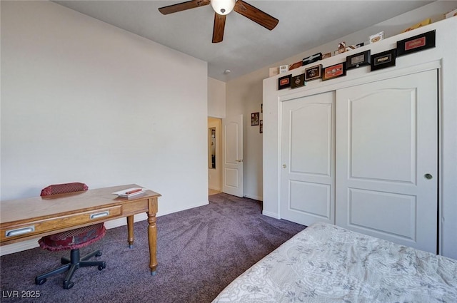 bedroom with dark carpet, ceiling fan, and a closet