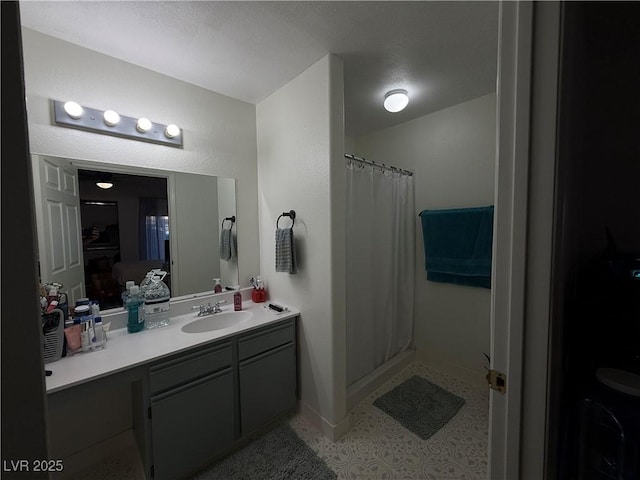 bathroom with vanity and curtained shower