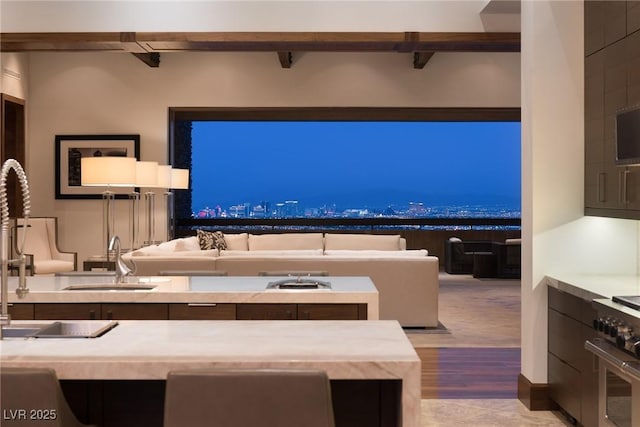 unfurnished living room with sink and light wood-type flooring