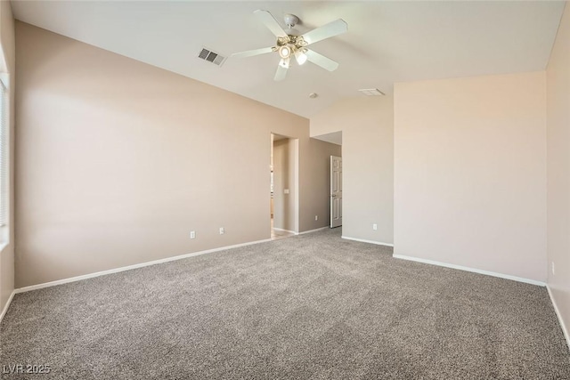 unfurnished room with ceiling fan, lofted ceiling, and carpet flooring