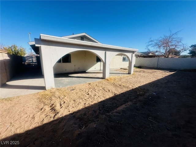 back of house featuring a patio