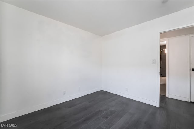 unfurnished room featuring dark hardwood / wood-style floors