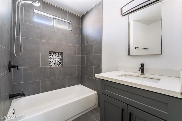 bathroom featuring vanity and tiled shower / bath combo