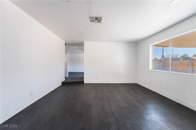 empty room with dark wood-type flooring