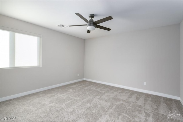 carpeted empty room featuring ceiling fan