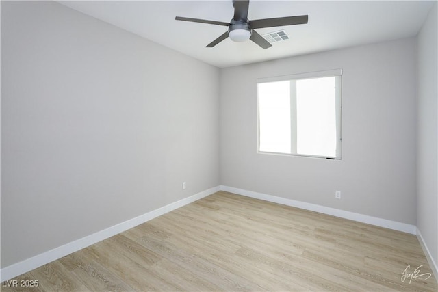 unfurnished room featuring light hardwood / wood-style flooring and ceiling fan