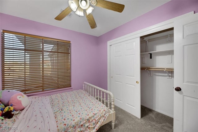 carpeted bedroom featuring a closet and ceiling fan