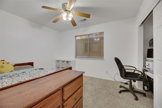 bedroom with a closet, ceiling fan, and carpet flooring