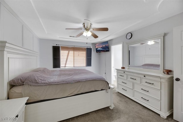 bedroom with ceiling fan and light carpet