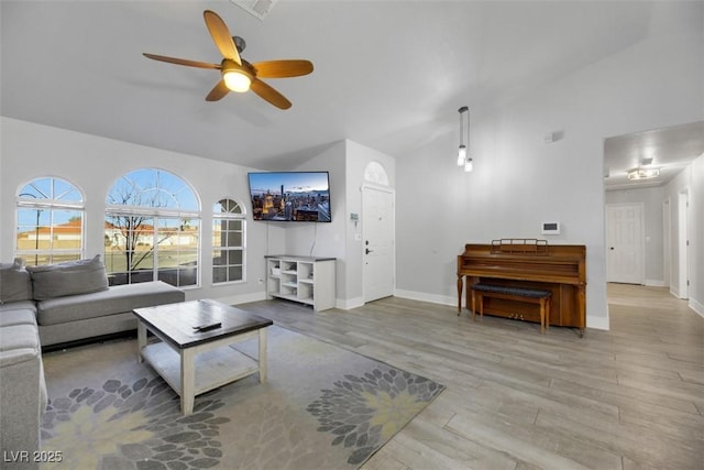 living room featuring ceiling fan and light wood-type flooring