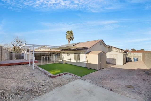 exterior space featuring a shed, a patio area, and a lawn