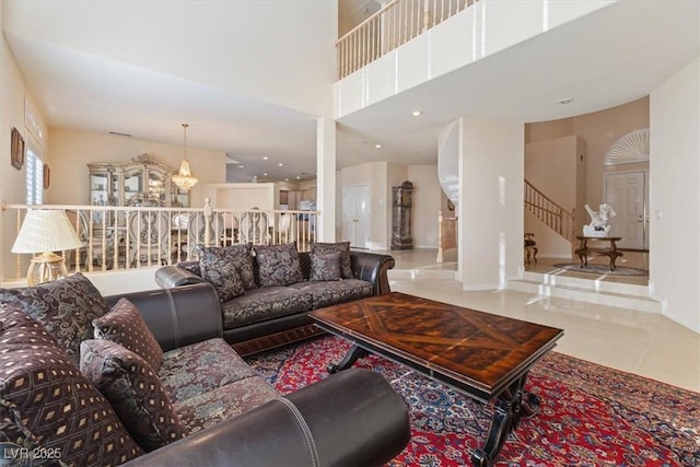 tiled living room with a high ceiling