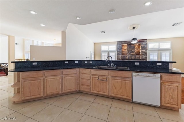 kitchen featuring light tile patterned flooring, white dishwasher, decorative light fixtures, and sink