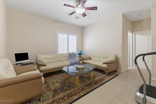 living room featuring light tile patterned floors and ceiling fan