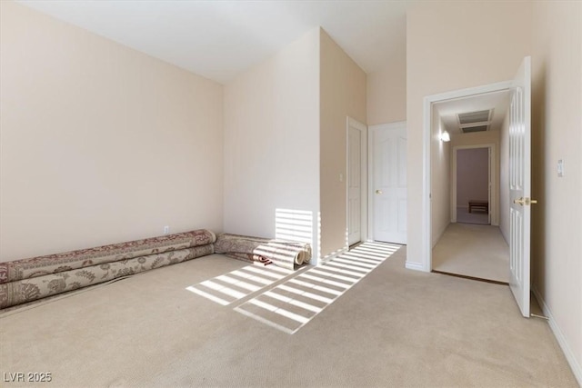 spare room with light colored carpet