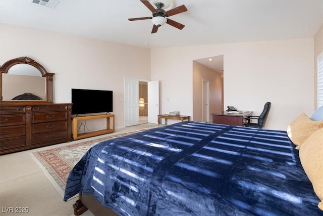 bedroom featuring vaulted ceiling, light carpet, and ceiling fan