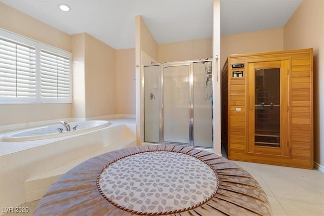 bathroom featuring tile patterned flooring and plus walk in shower