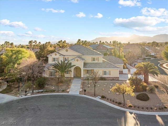 view of front of property with a mountain view