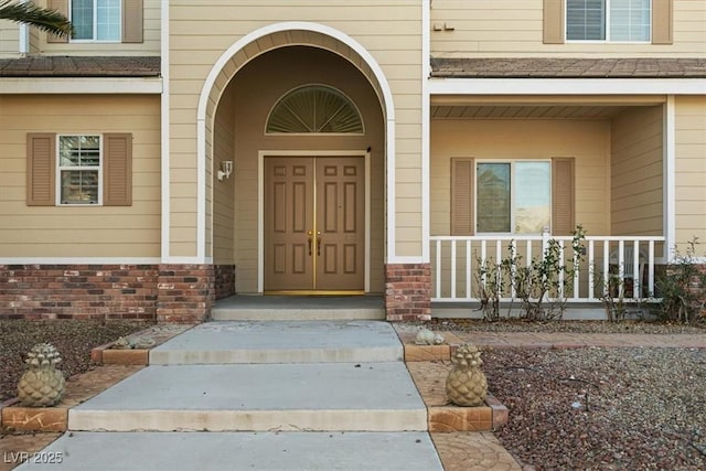 property entrance with covered porch