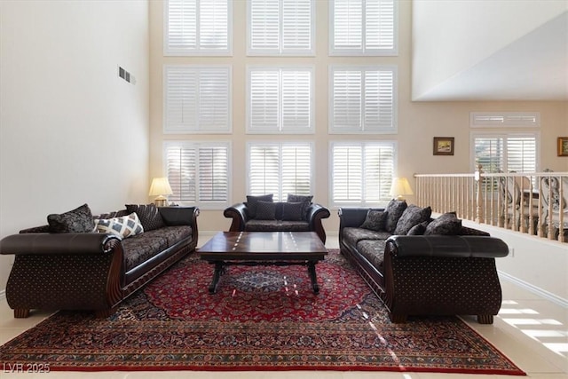 living room with a high ceiling