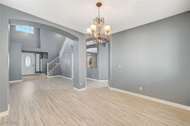 interior space with light hardwood / wood-style flooring and a chandelier