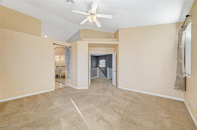 interior space featuring lofted ceiling, plenty of natural light, carpet, and ceiling fan