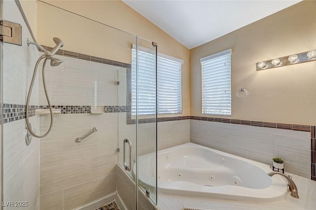 bathroom featuring plus walk in shower and vaulted ceiling