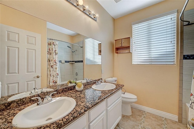 bathroom with toilet, vanity, tile patterned floors, and a shower with curtain