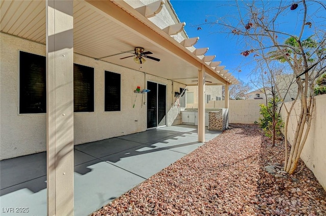 view of patio with ceiling fan