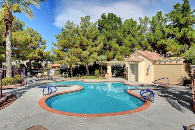 view of swimming pool with a pergola and a patio area