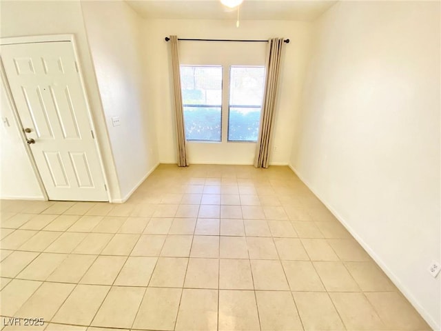 empty room with light tile patterned floors