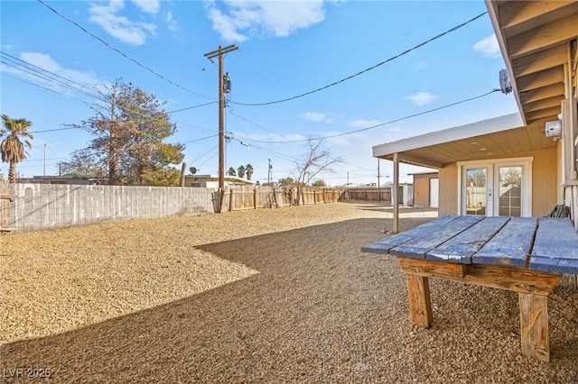 view of yard featuring french doors