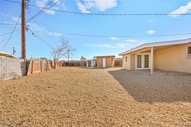 view of yard with french doors